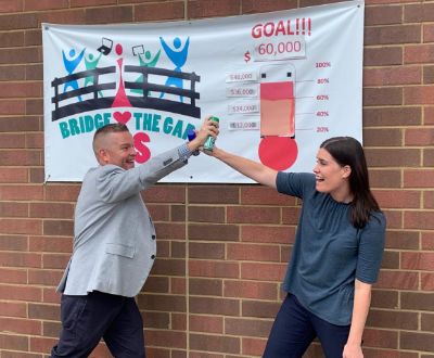 Trent Satterfield and Genevieve McKinney celebrating the Bridge the Gap Campaign